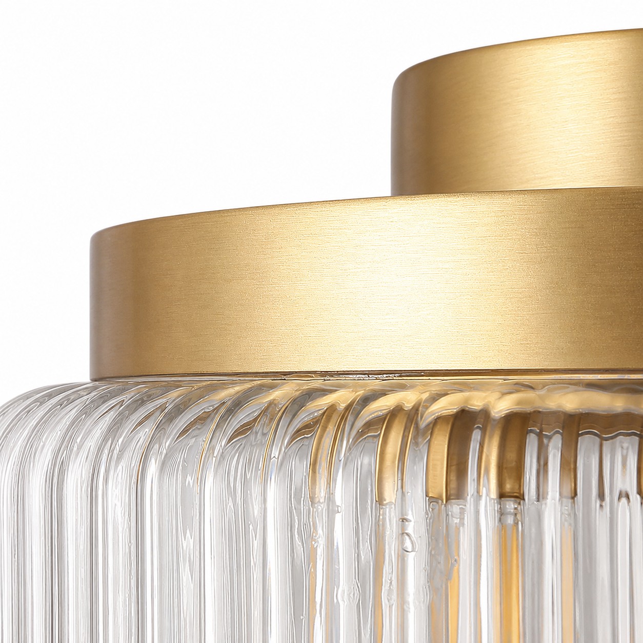 Ribbed glass shade with warm antique brass detail