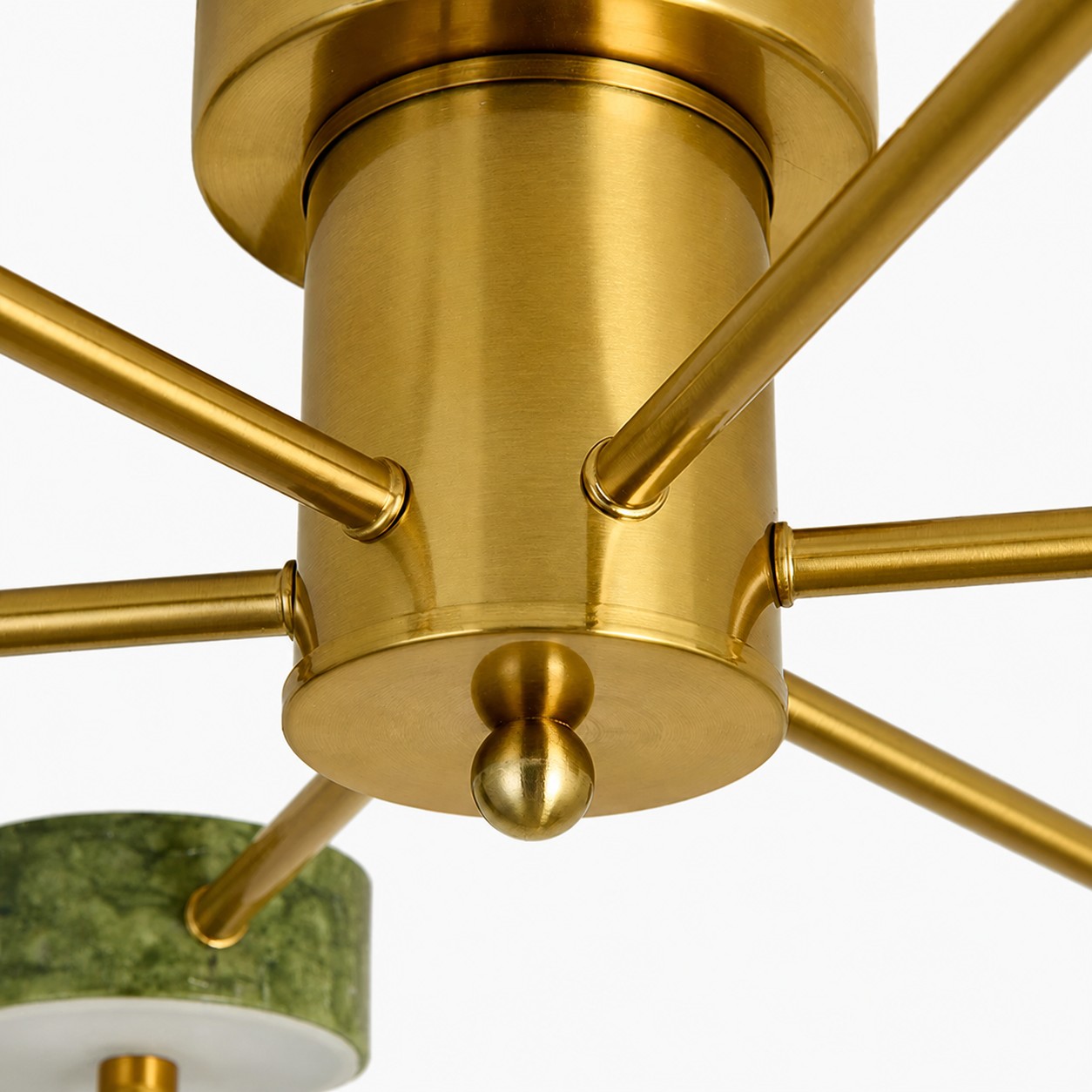 Close-up of the warm metal center and radial arms