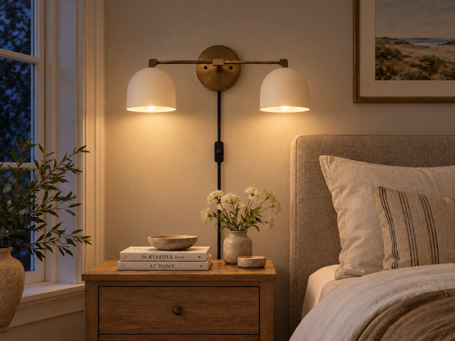 White metal domes lit from below, with warm light on the bedside wall
