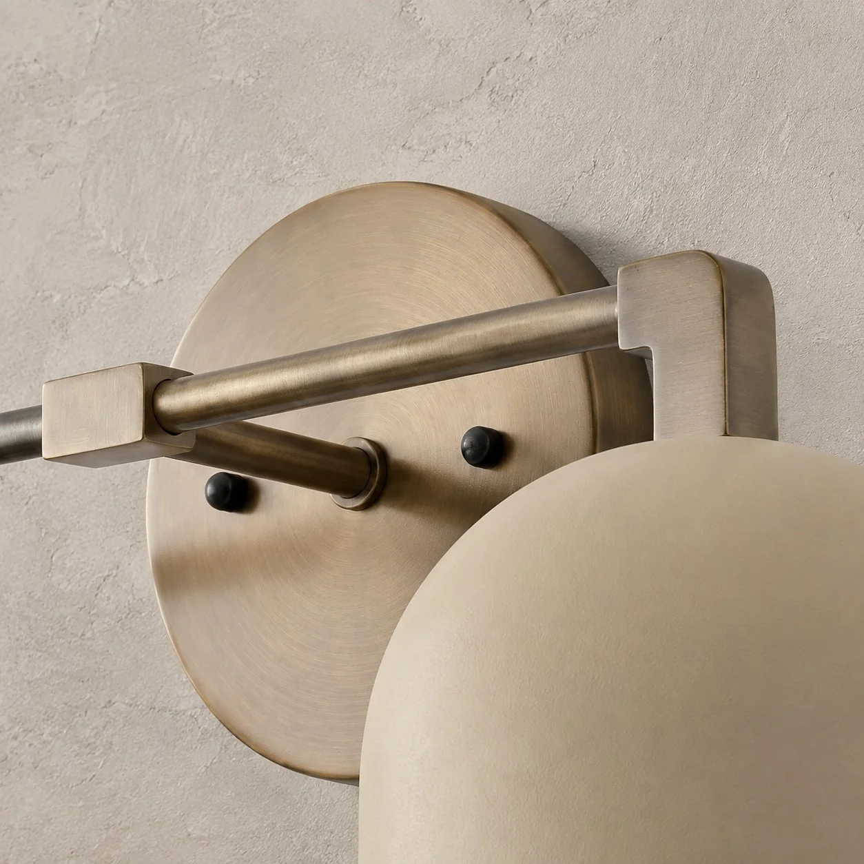 Metal bar joined to the round plate by a short stem and square collar