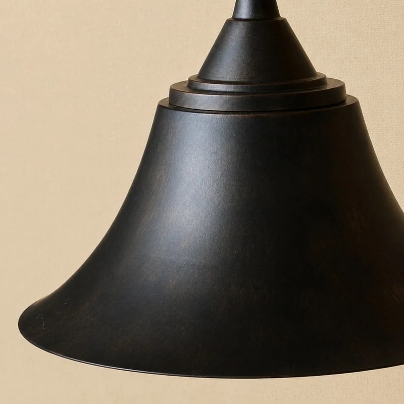 Black rustic outdoor wall sconce on a clean background