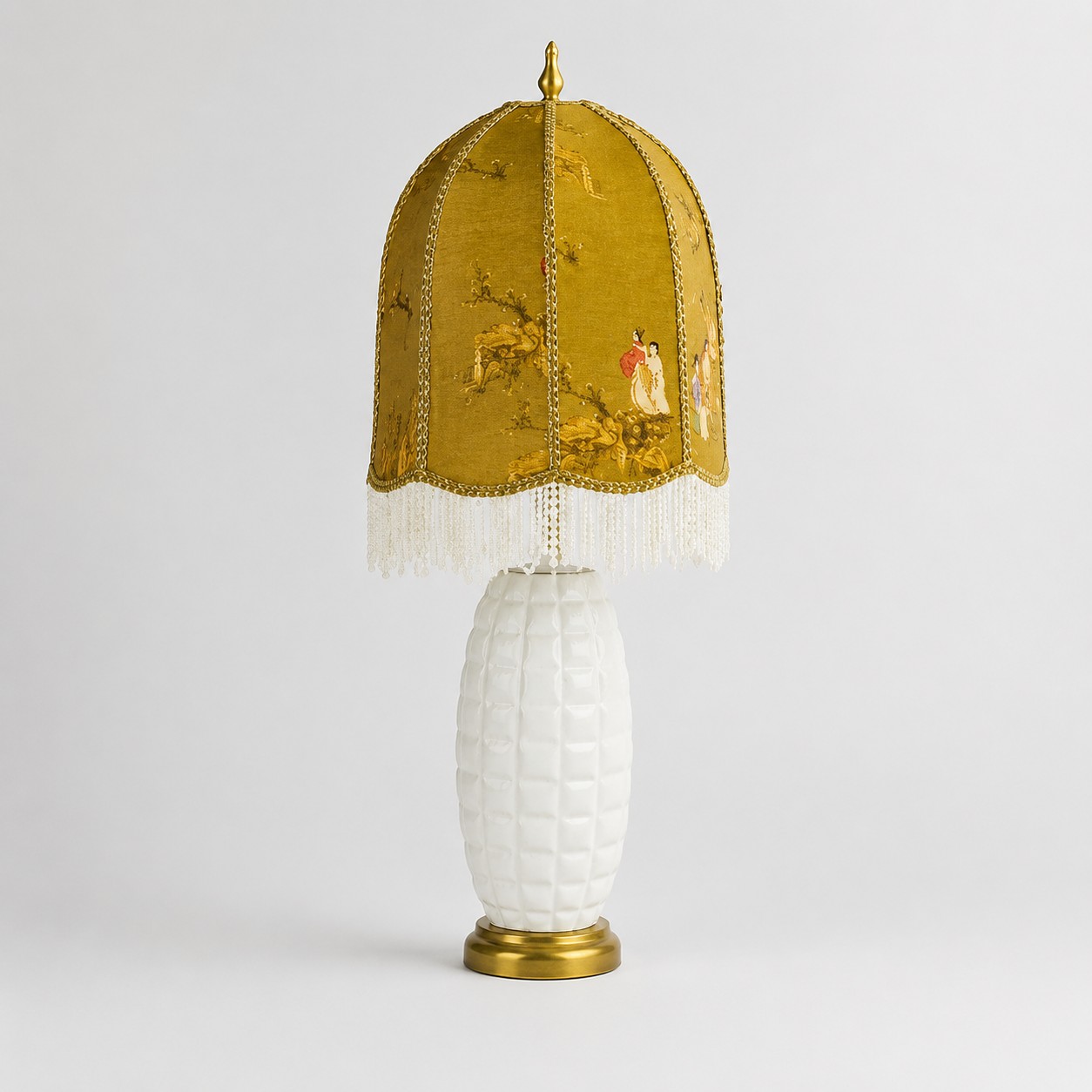 Full view of the vintage ceramic table lamp with beaded fringe shade