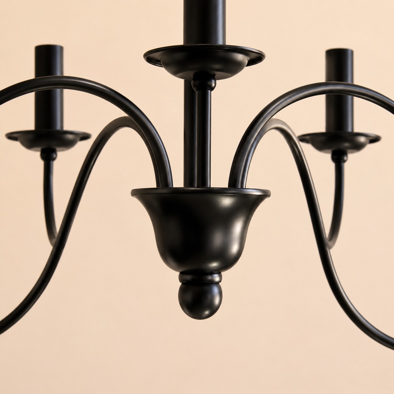 Close view of the chandelier center and sweeping arms