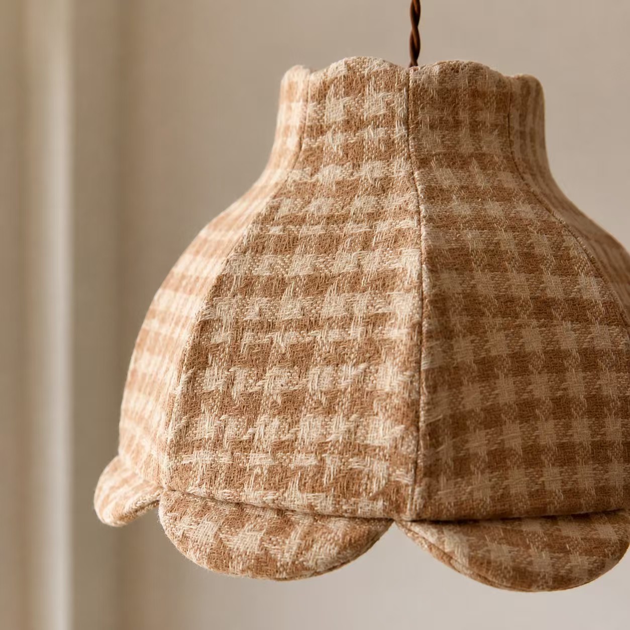 Close detail of the plaid fabric pendant light craftsmanship