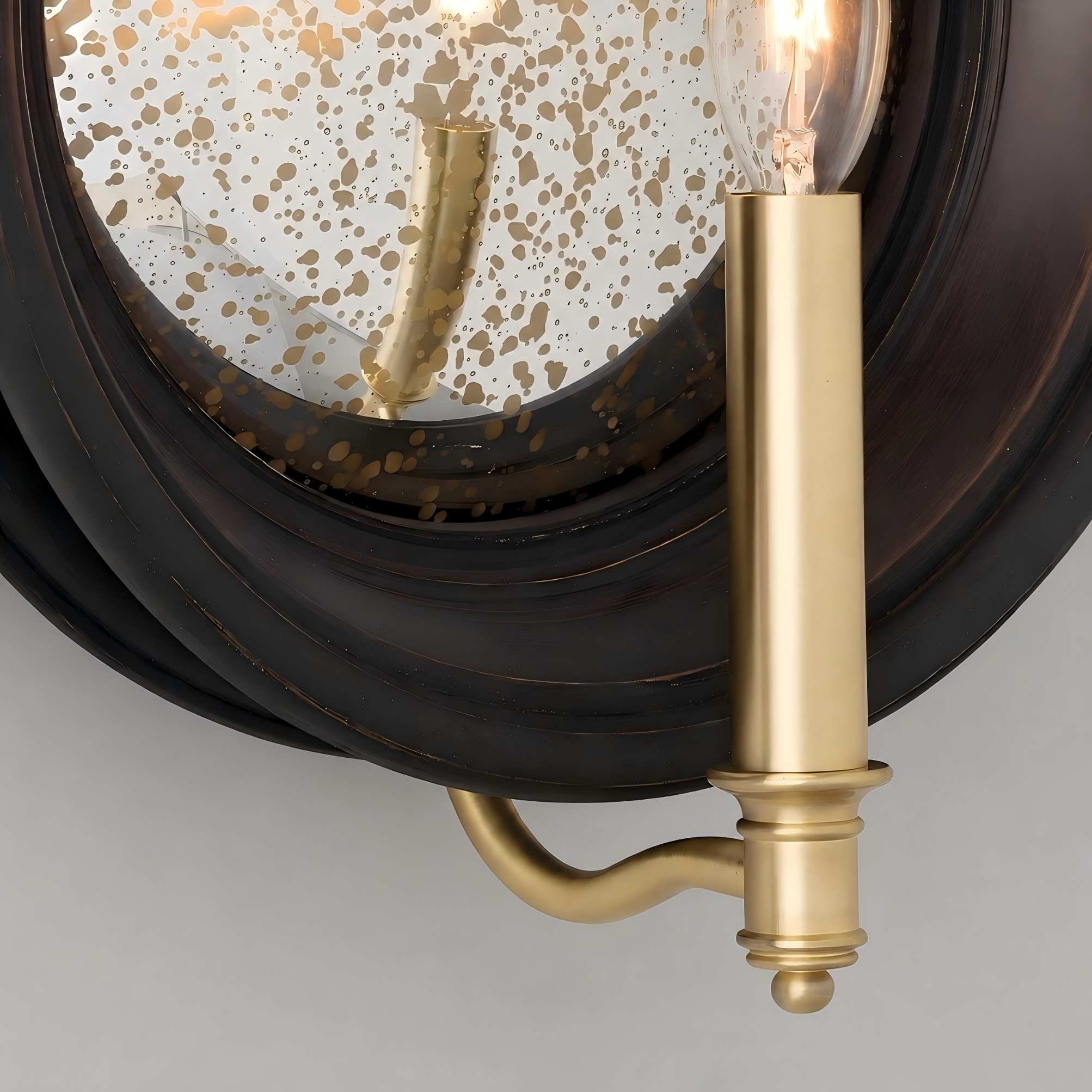 Brass candle arm and vintage black backplate detail