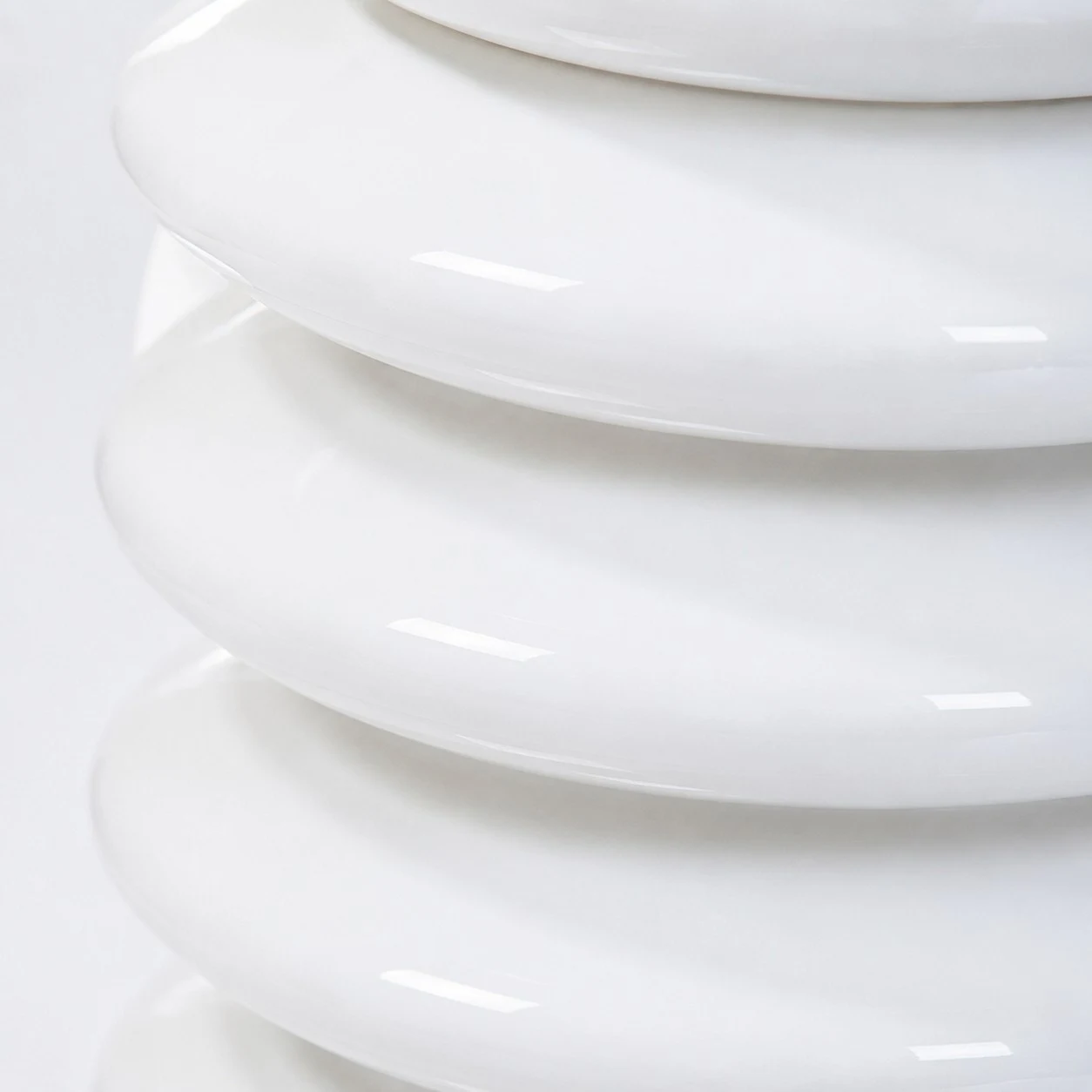 Macro view of glossy white ribbed glass texture