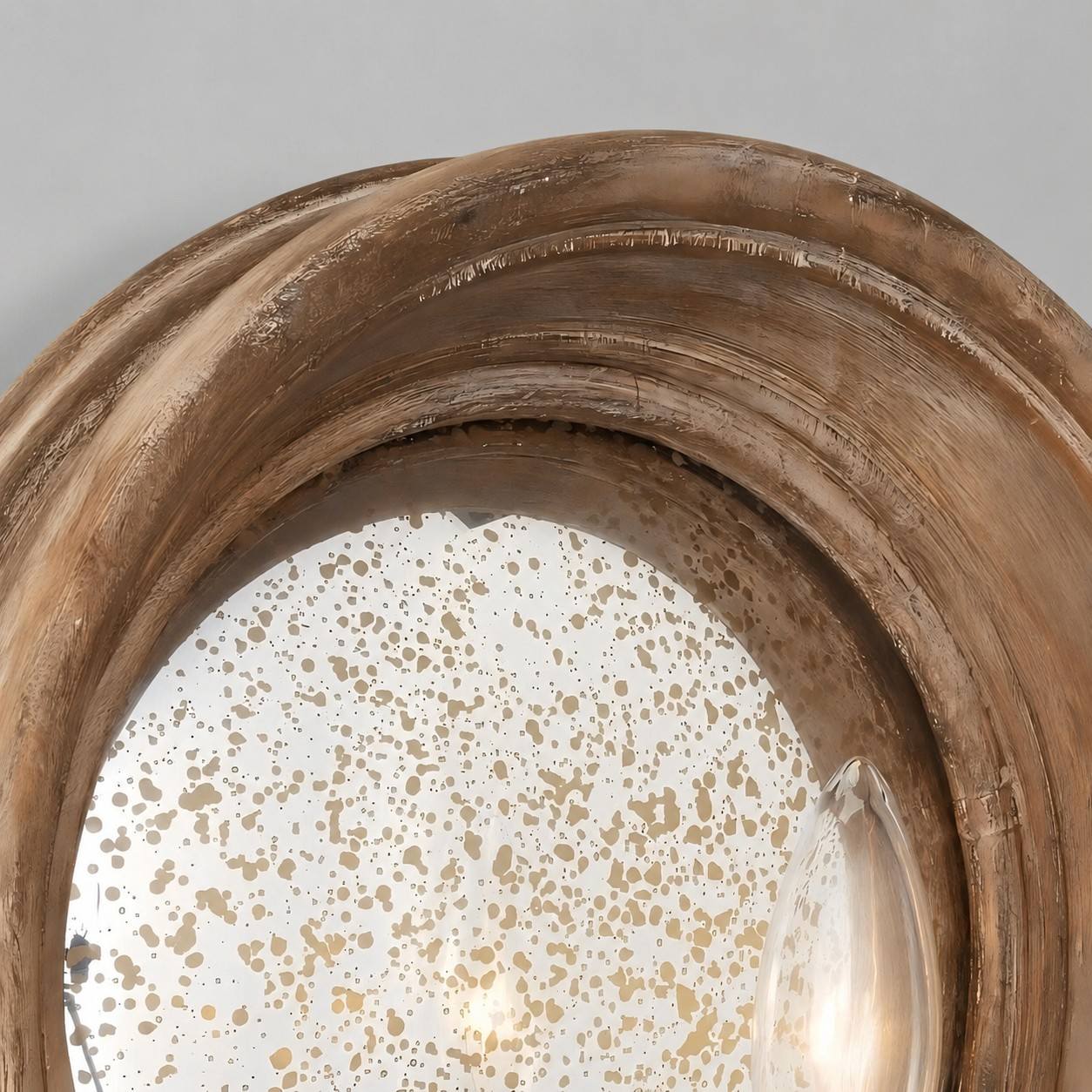Natural wood frame and speckled mirror detail
