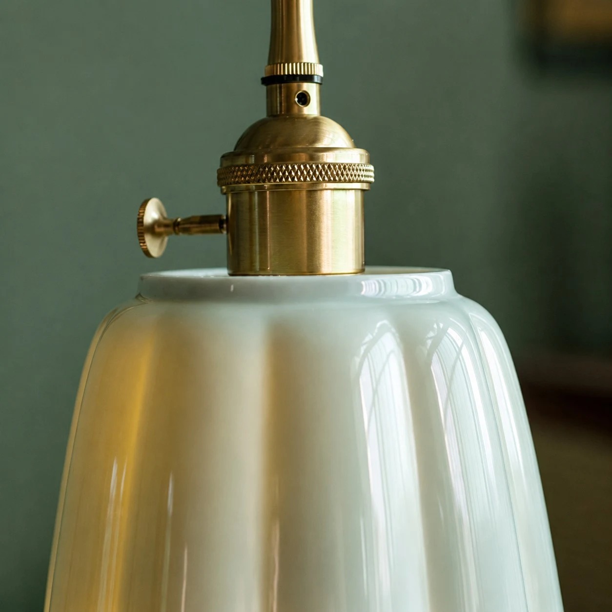 Metal holder and glazed ceramic lotus shade detail