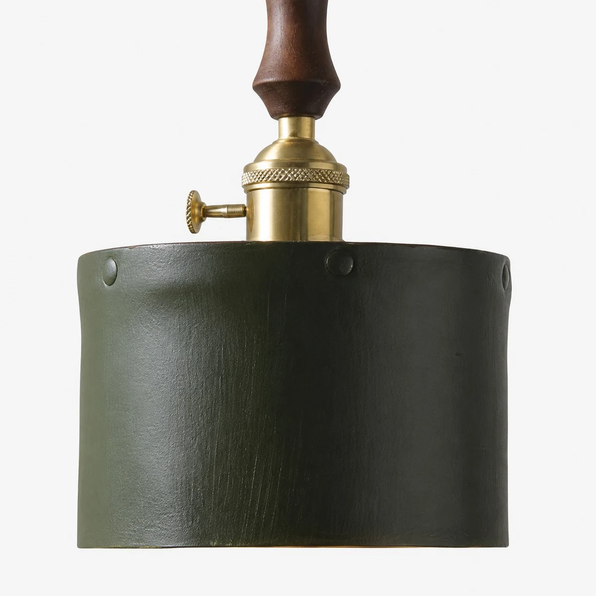 green cylindrical leather shade texture and brass fitting detail