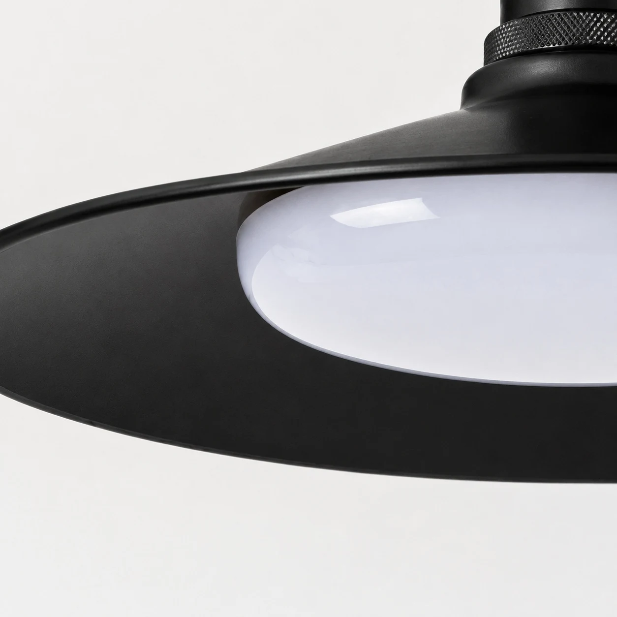Black metal shade and rounded diffuser detail