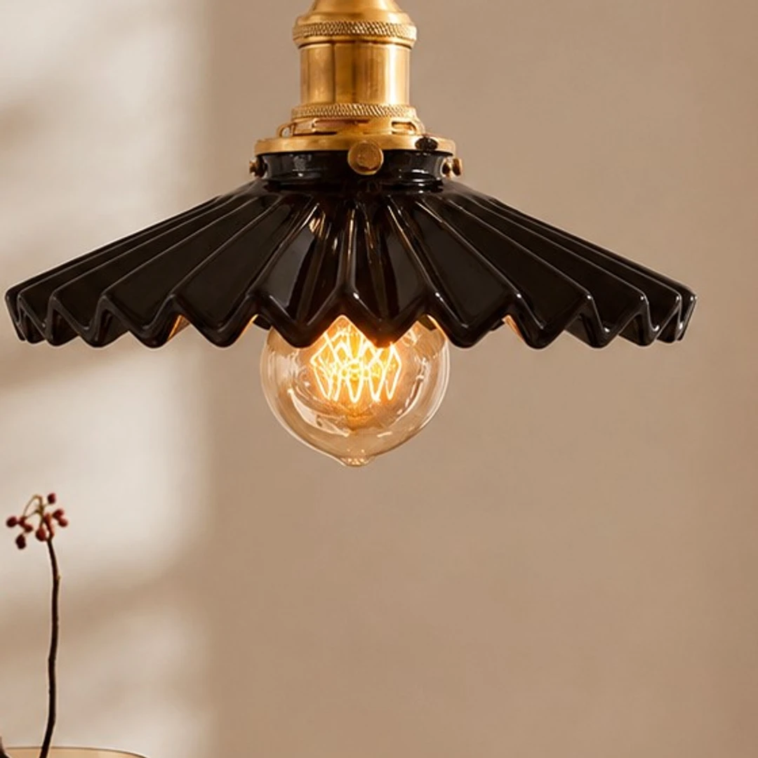 Close view of the glossy black ceramic pleats