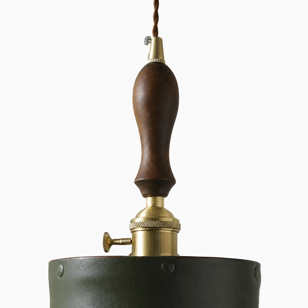 wood handle brass socket and green leather shade close up