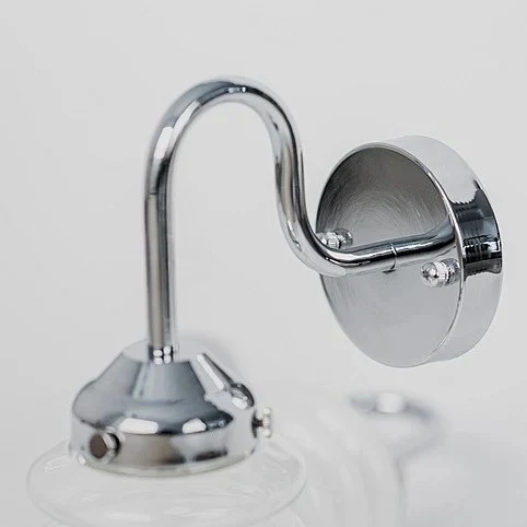 Curved chrome arm and round wall plate