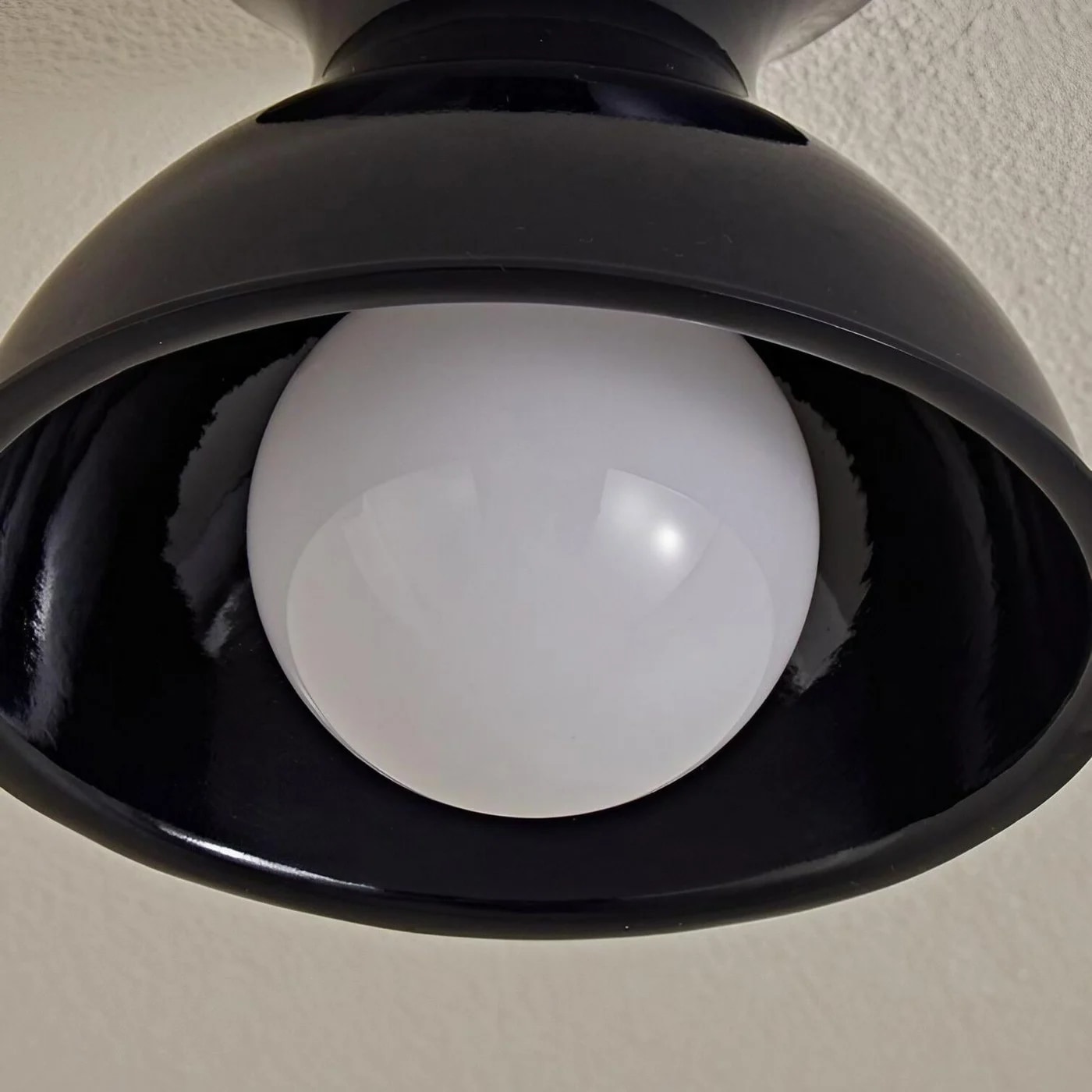 Close view of the ceiling light shade and globe diffuser