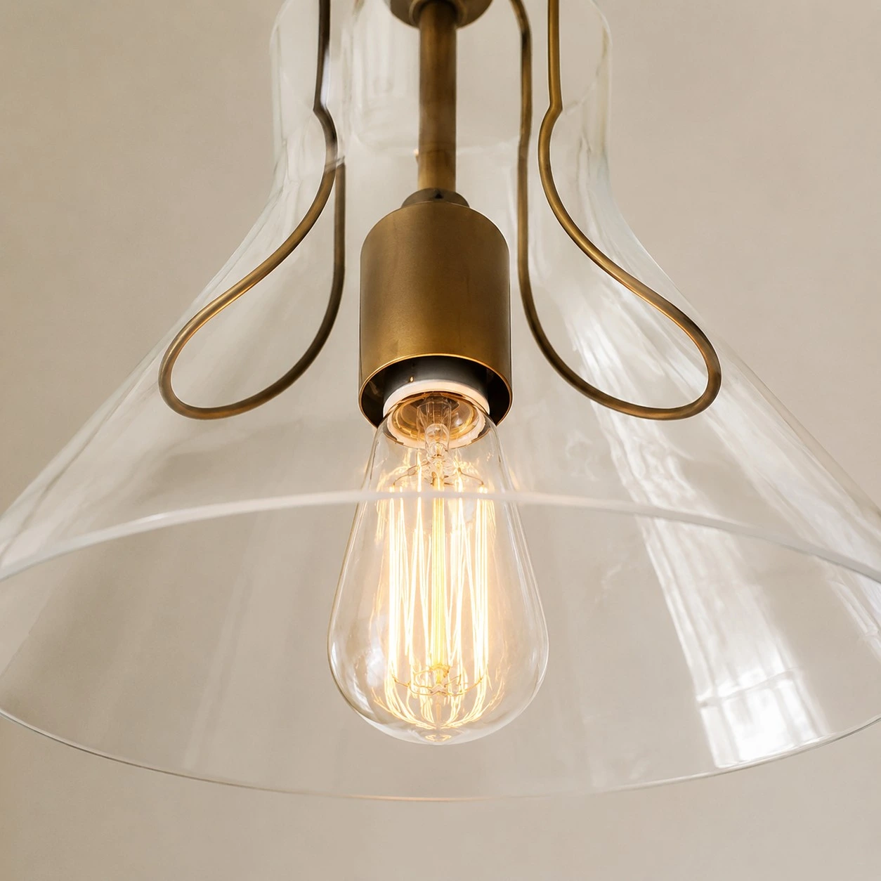 Close view of the clear umbrella glass shade and inner holder
