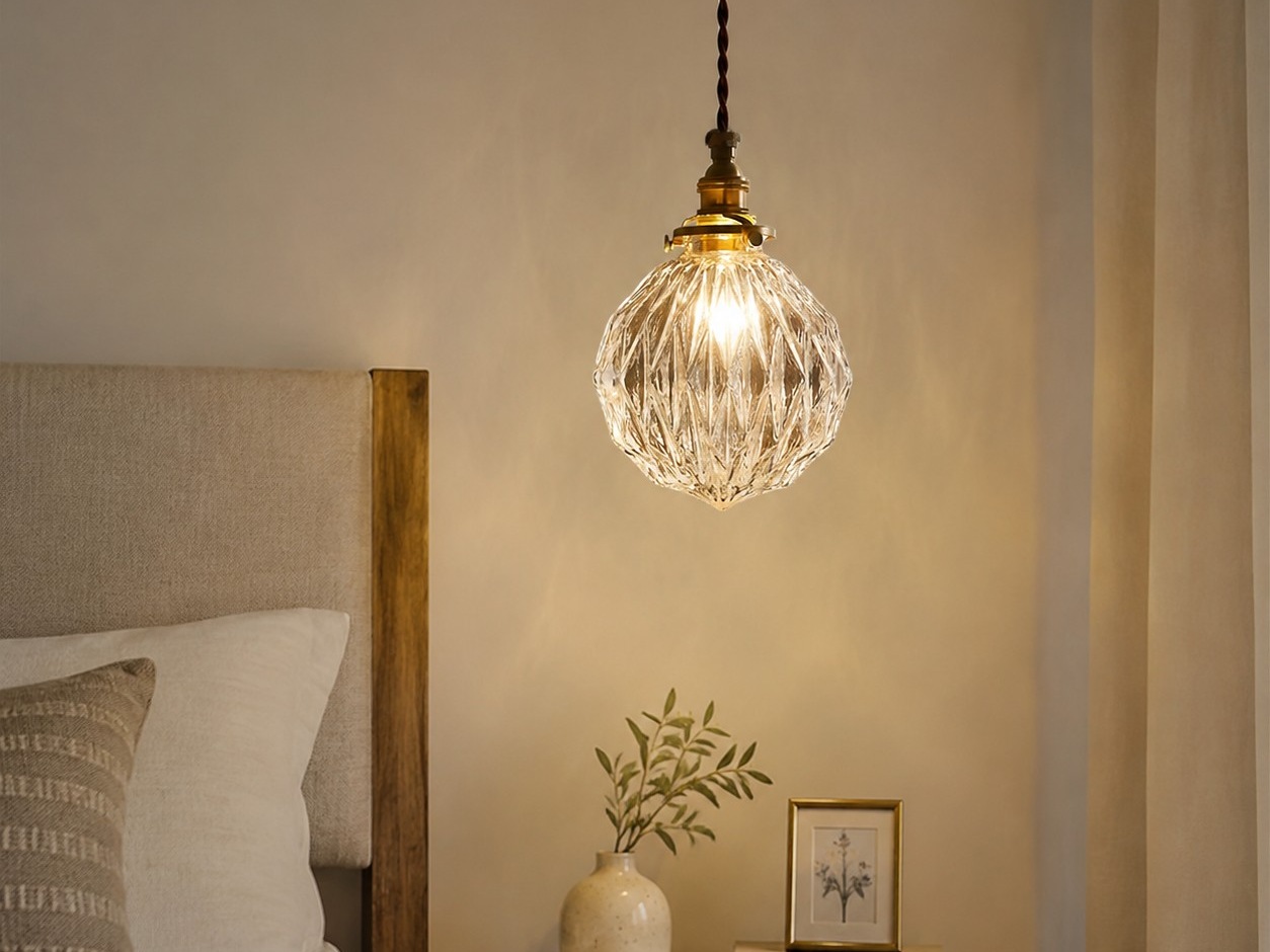 brass glass pendant light used as warm bedside lighting