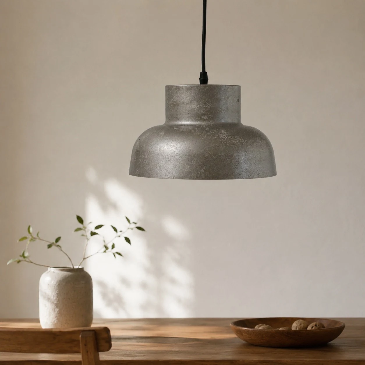 Aged metal pendant in a minimal setting