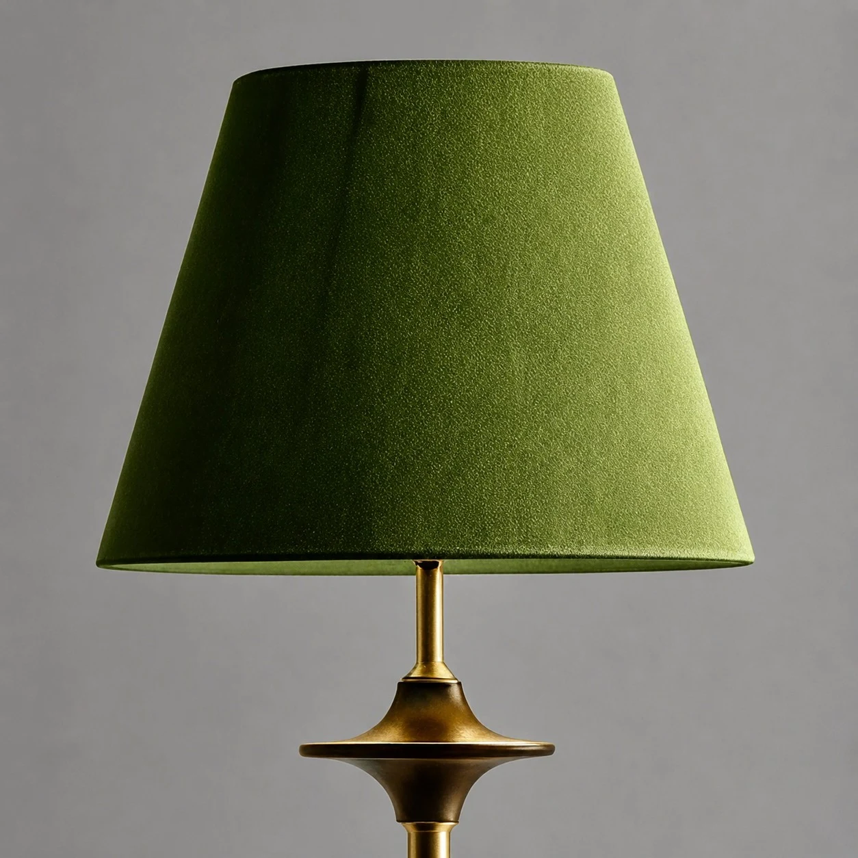Green fabric shade and brass tone lamp stem