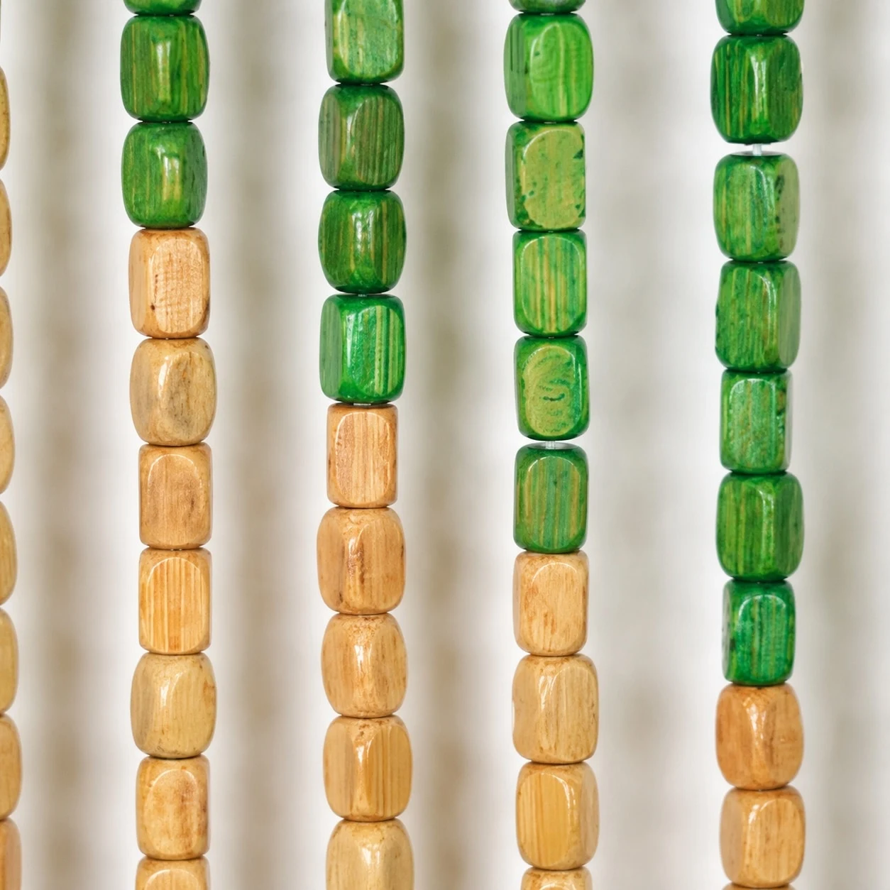 Green and natural wood bead close-up