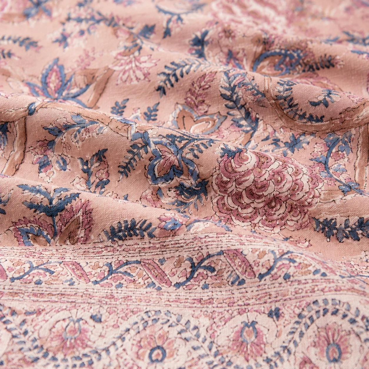 Woven texture with a softened floral border