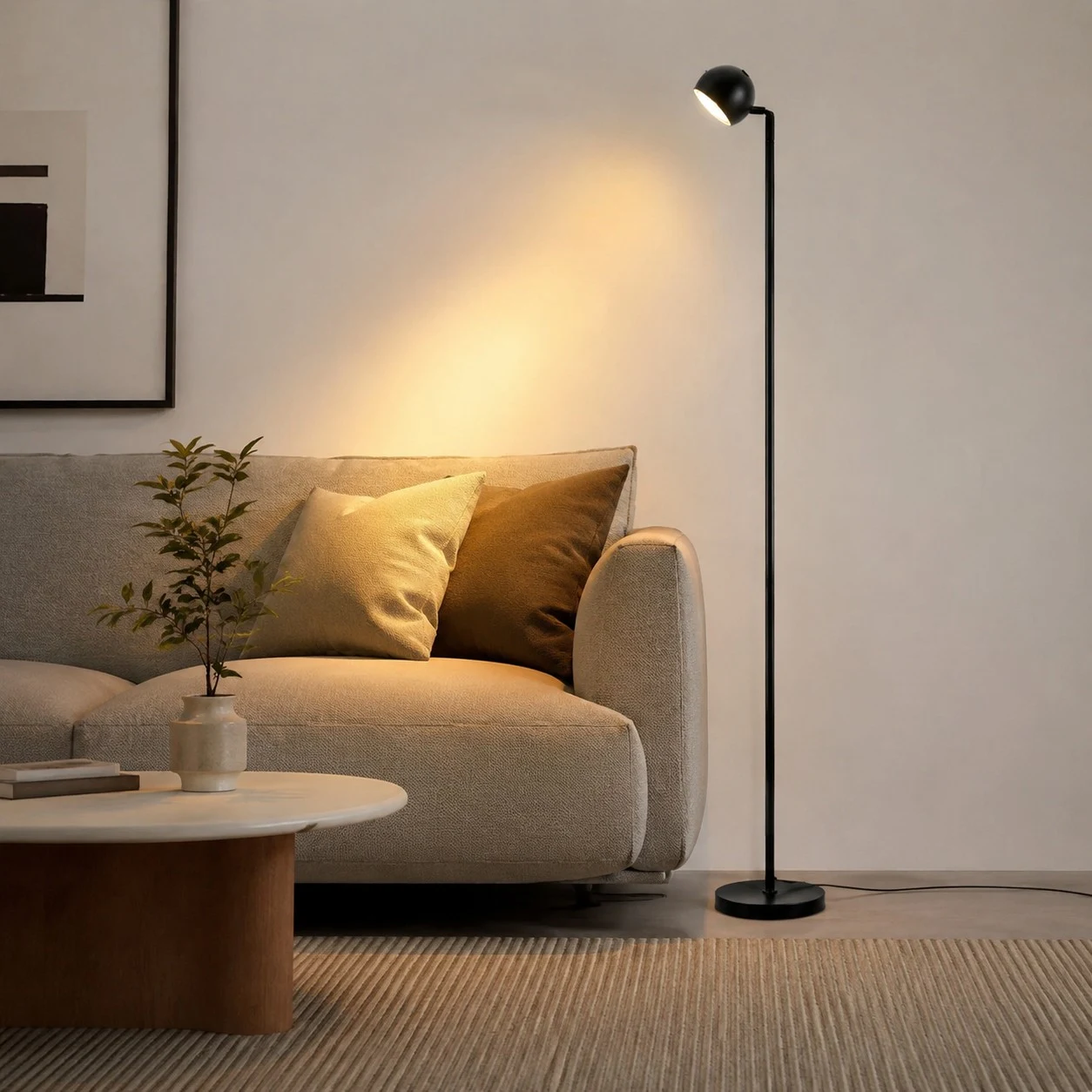 Black floor lamp styled beside a living room sofa