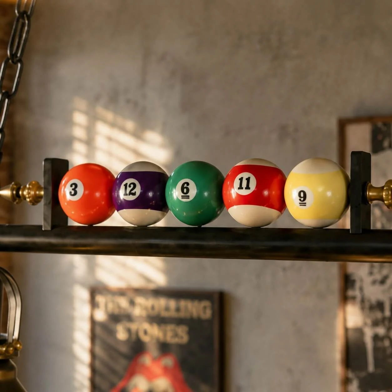 Decorative billiard-ball rail detail on the fixture bar
