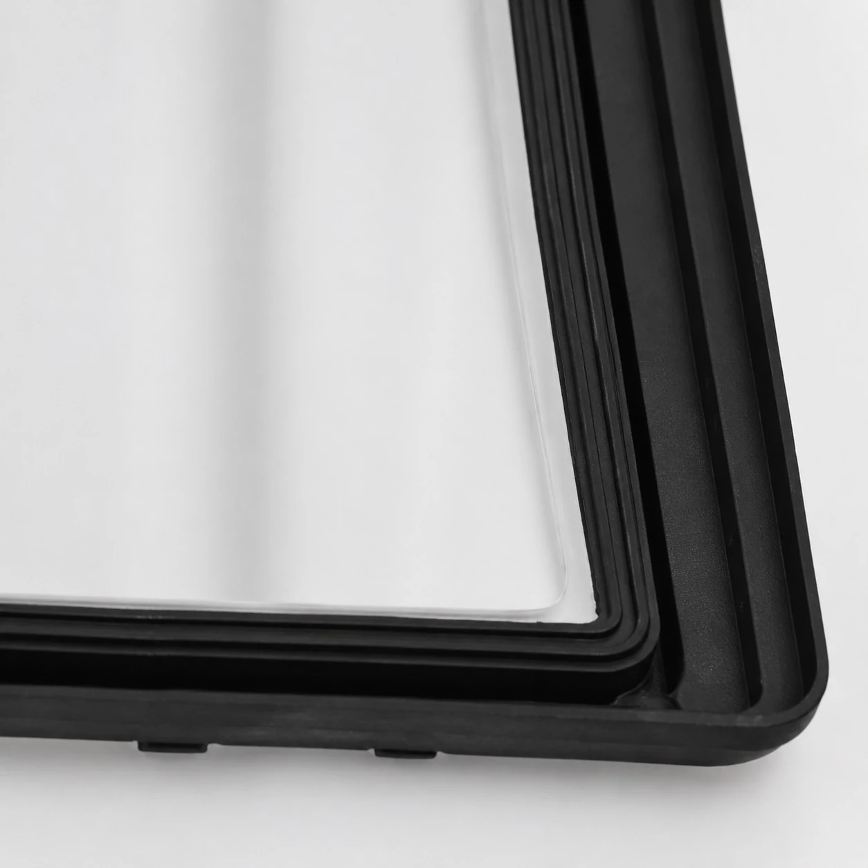 Close-up of the black frame and white glass shade