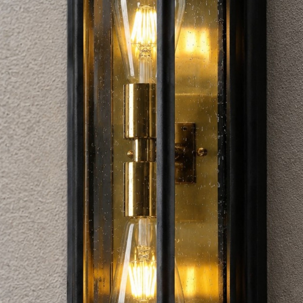 Outdoor wall lamp brass-tone bulb holder detail