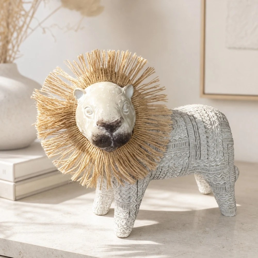 Resin lion ornament styled on a neutral tabletop shelf