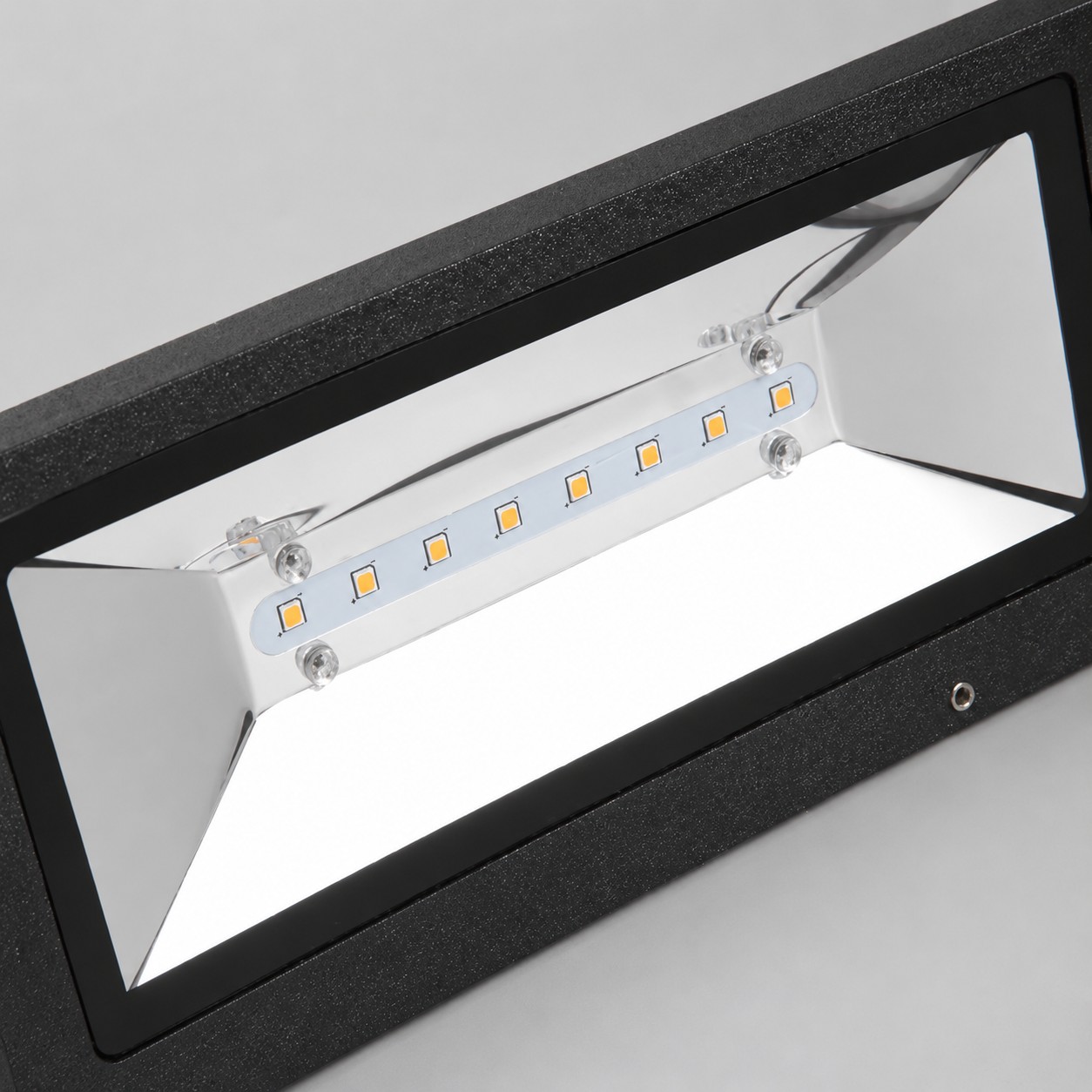 Textured black aluminum finish on the wall light housing