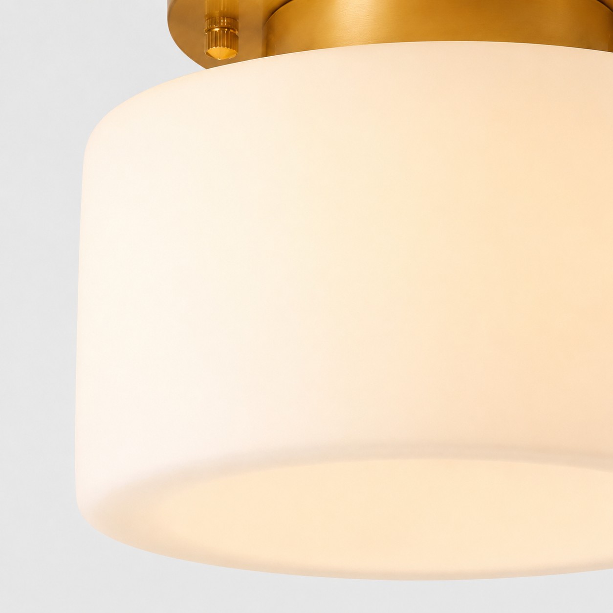 Close detail of glowing cylindrical glass shade