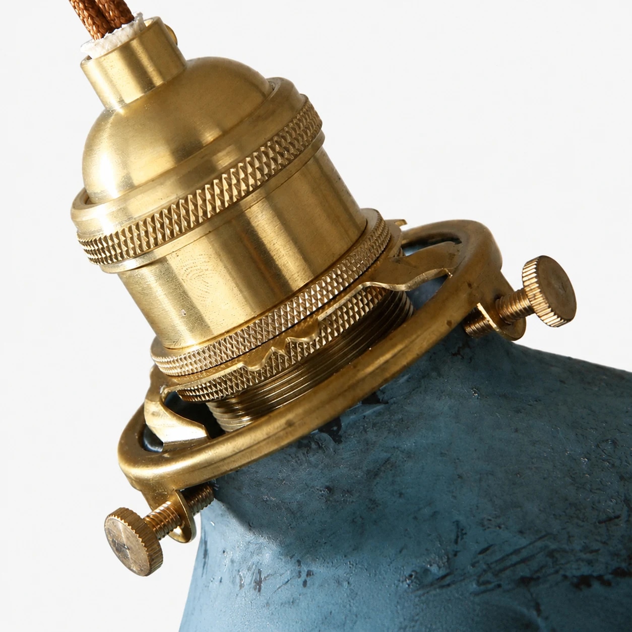 Brass tone hardware and adjustable clamp detail