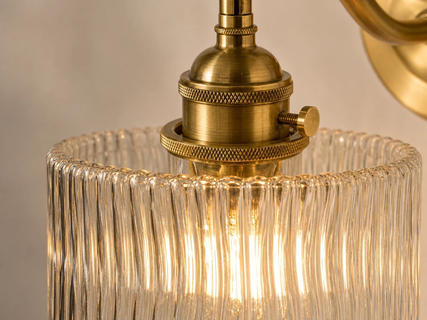 Close detail of ribbed glass and brass hardware