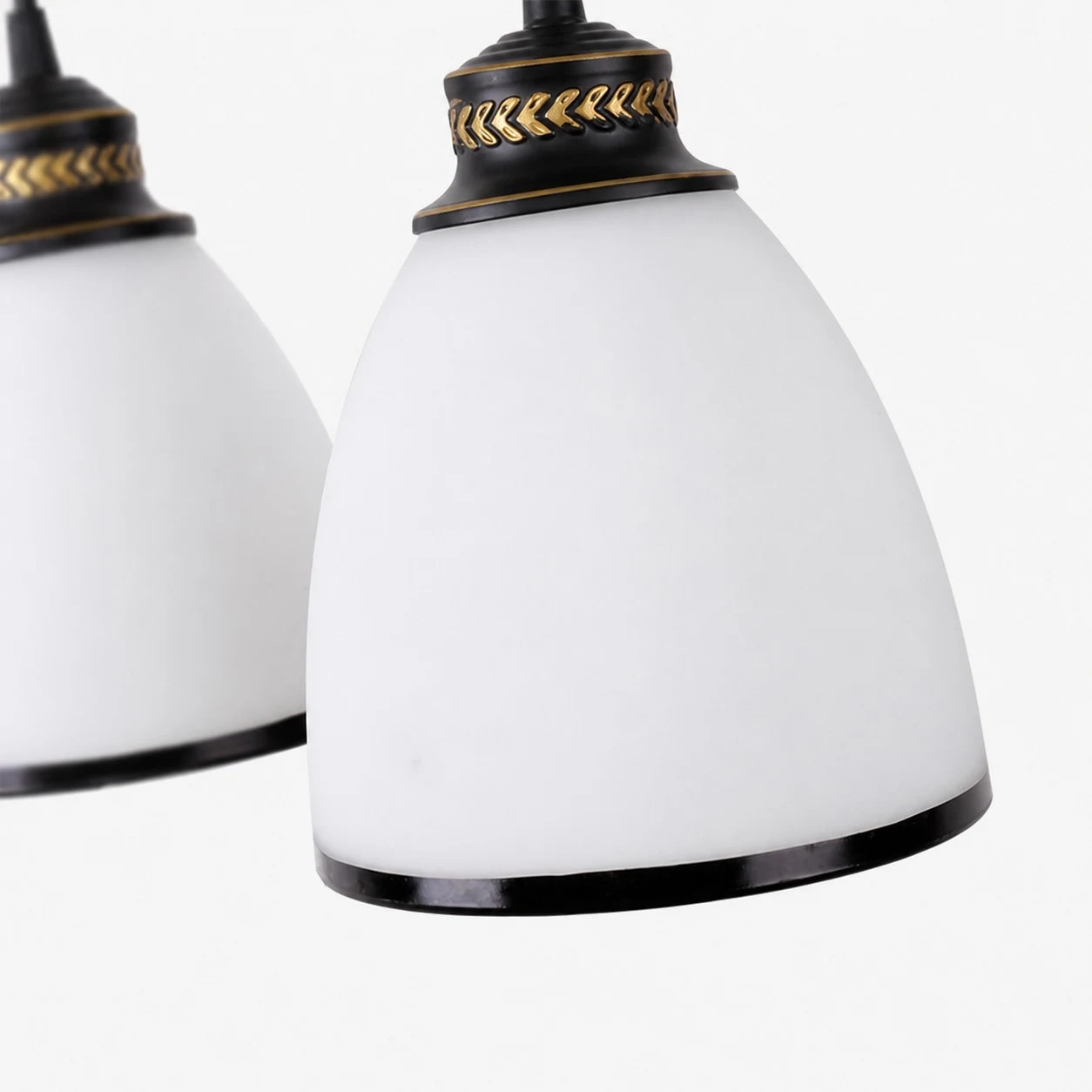 Close view of the milky glass shade with black trim and gold accent