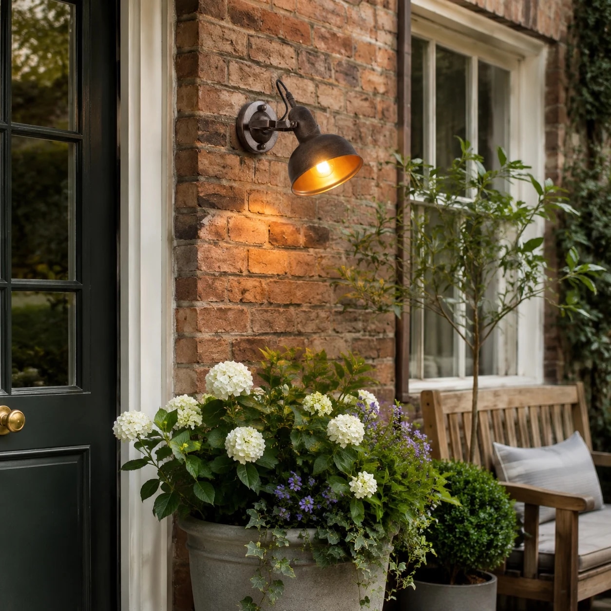 Vintage industrial wall light installed beside an outdoor doorway