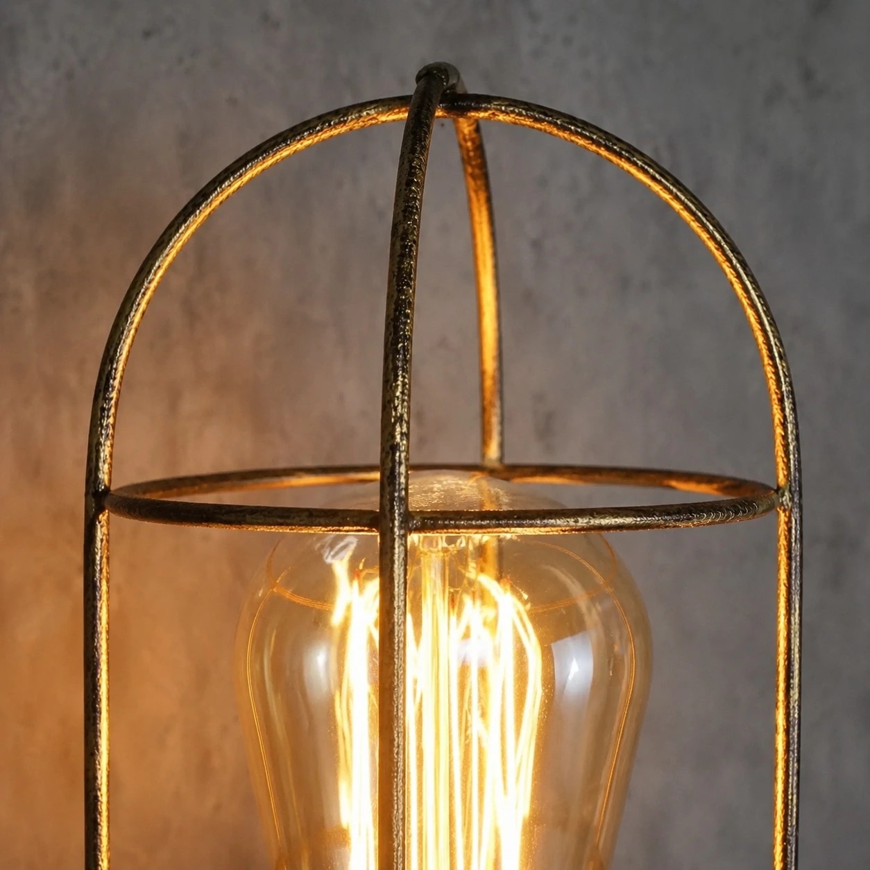 Iron wall sconce glowing cage detail