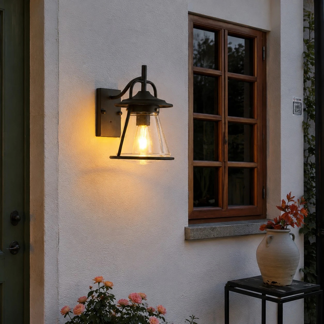 Outdoor lantern beside entry window