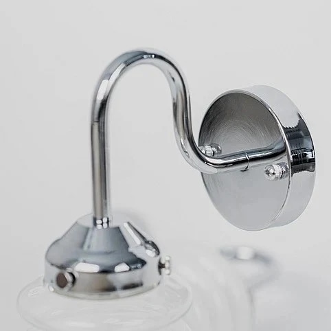 Curved chrome arm and round wall plate