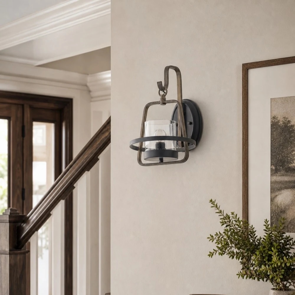 Rust metal clear glass wall sconce installed near staircase and entry furniture