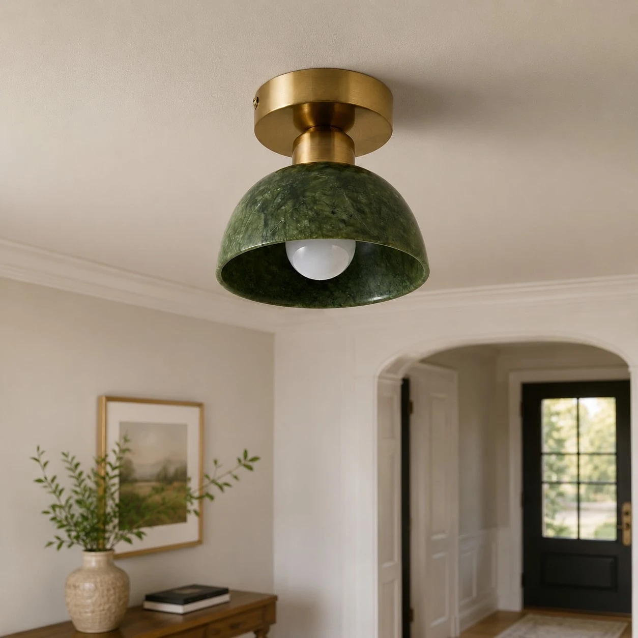 Green stone brass flush mount ceiling light installed in hallway