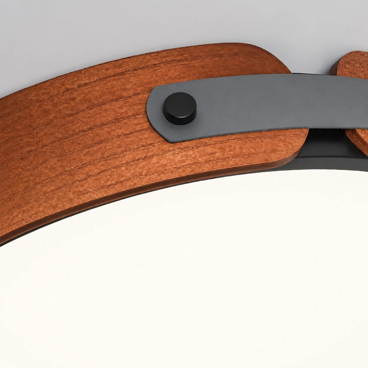 Walnut-toned rim and dark metal bracket detail