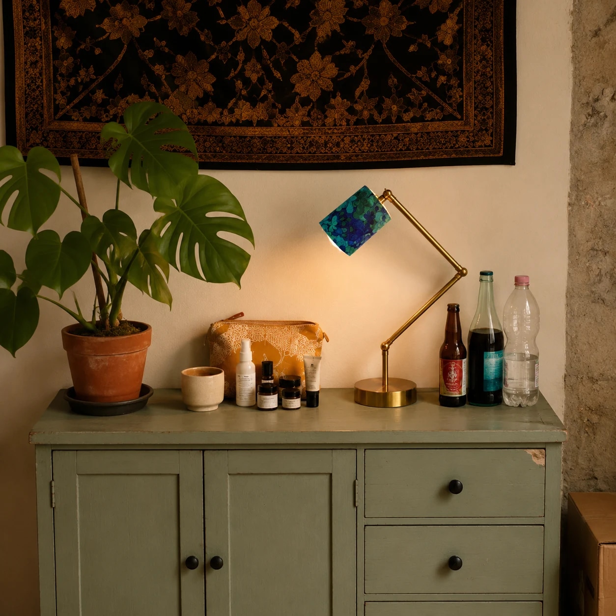 Floral table lamp on a bedside table beside a wooden bed