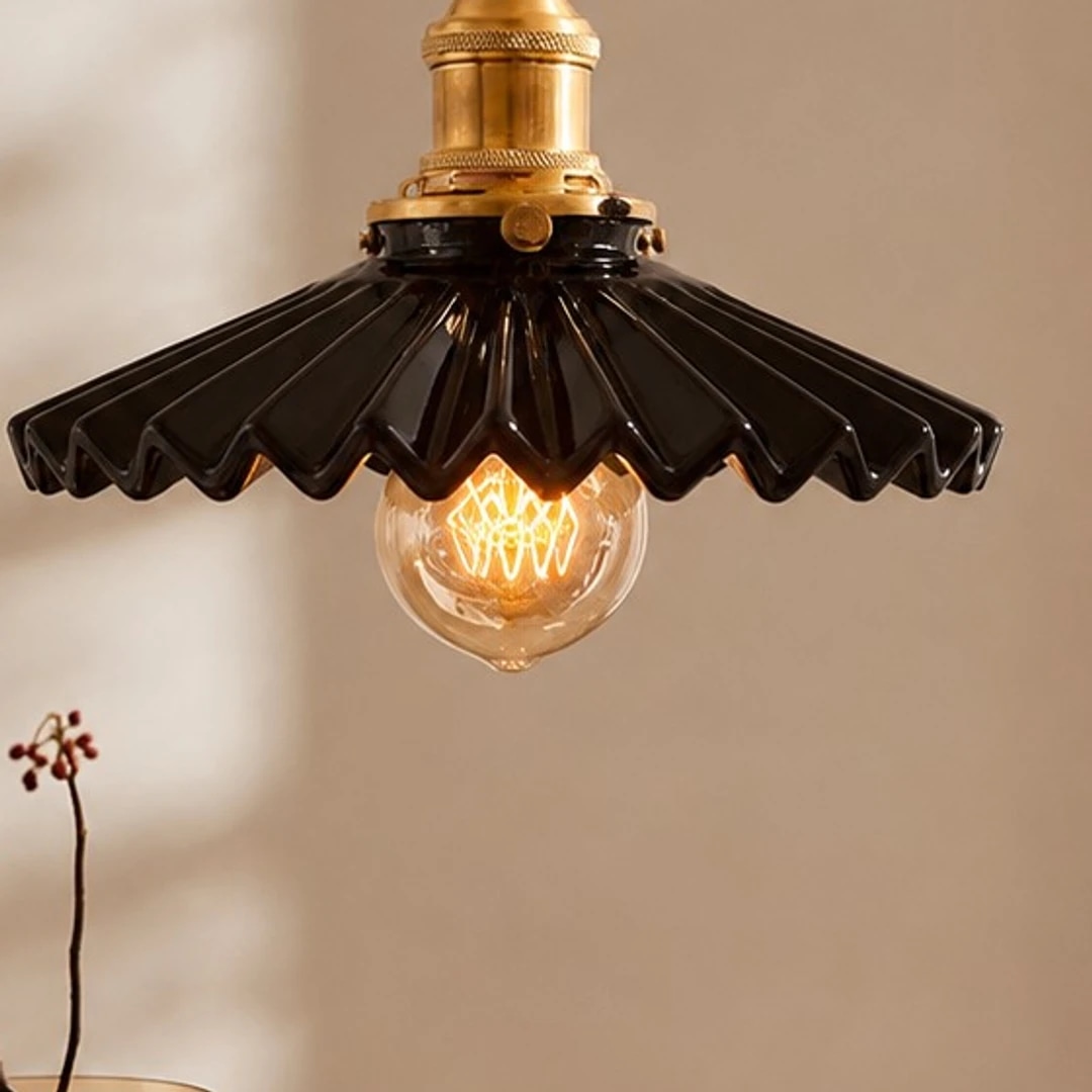 Close view of the glossy black ceramic pleats