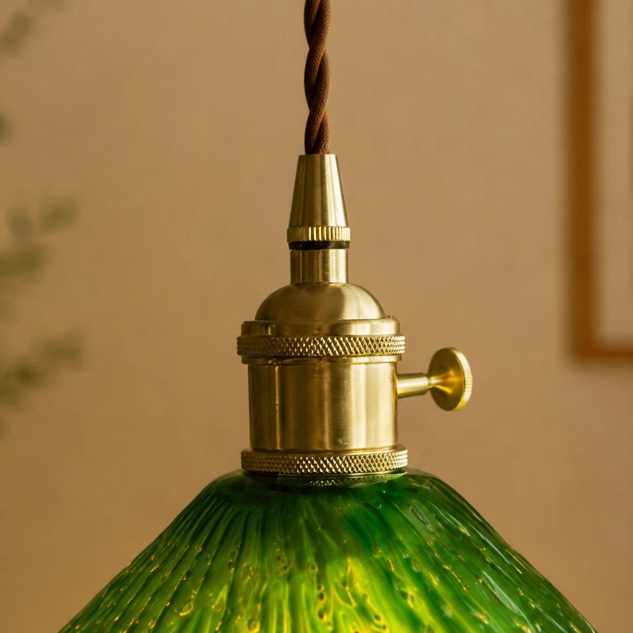 Brass-tone pendant holder detail