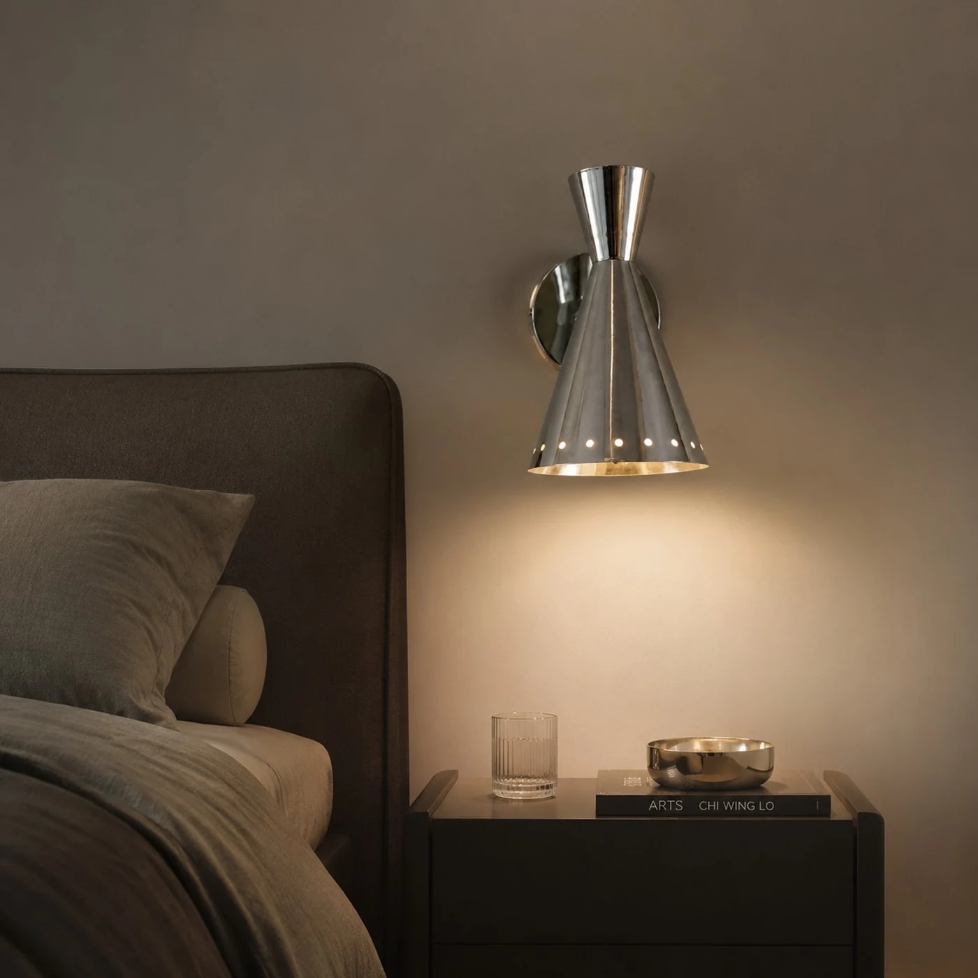 Warm bedside wall sconce lighting scene