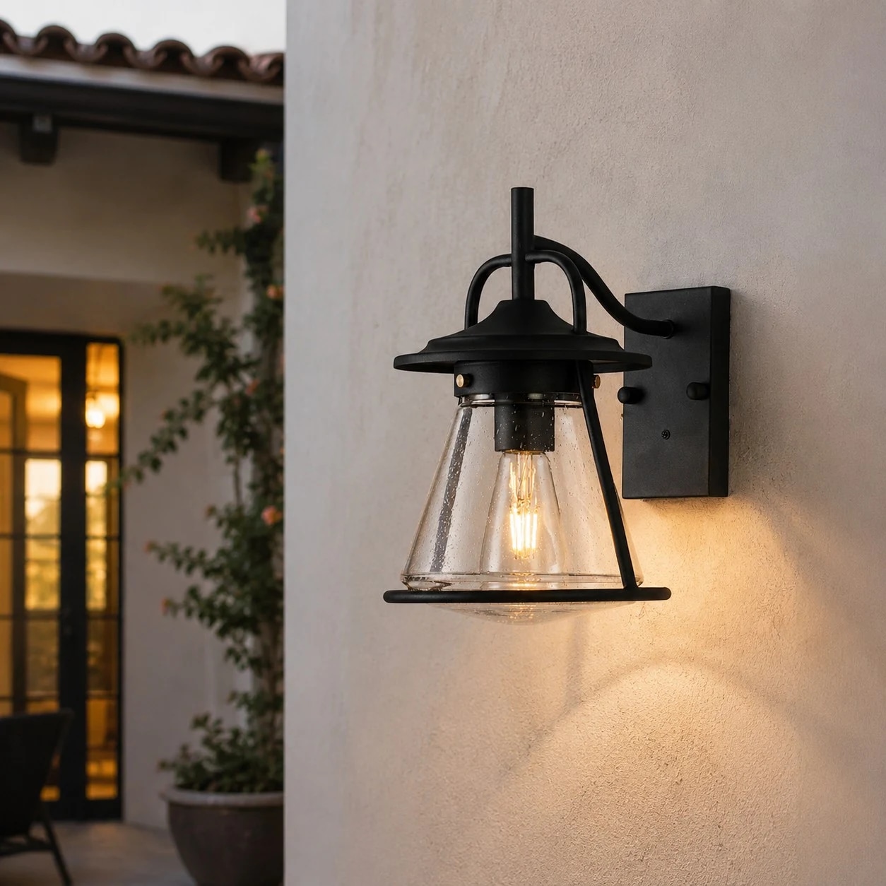 Outdoor black glass wall lantern in exterior setting
