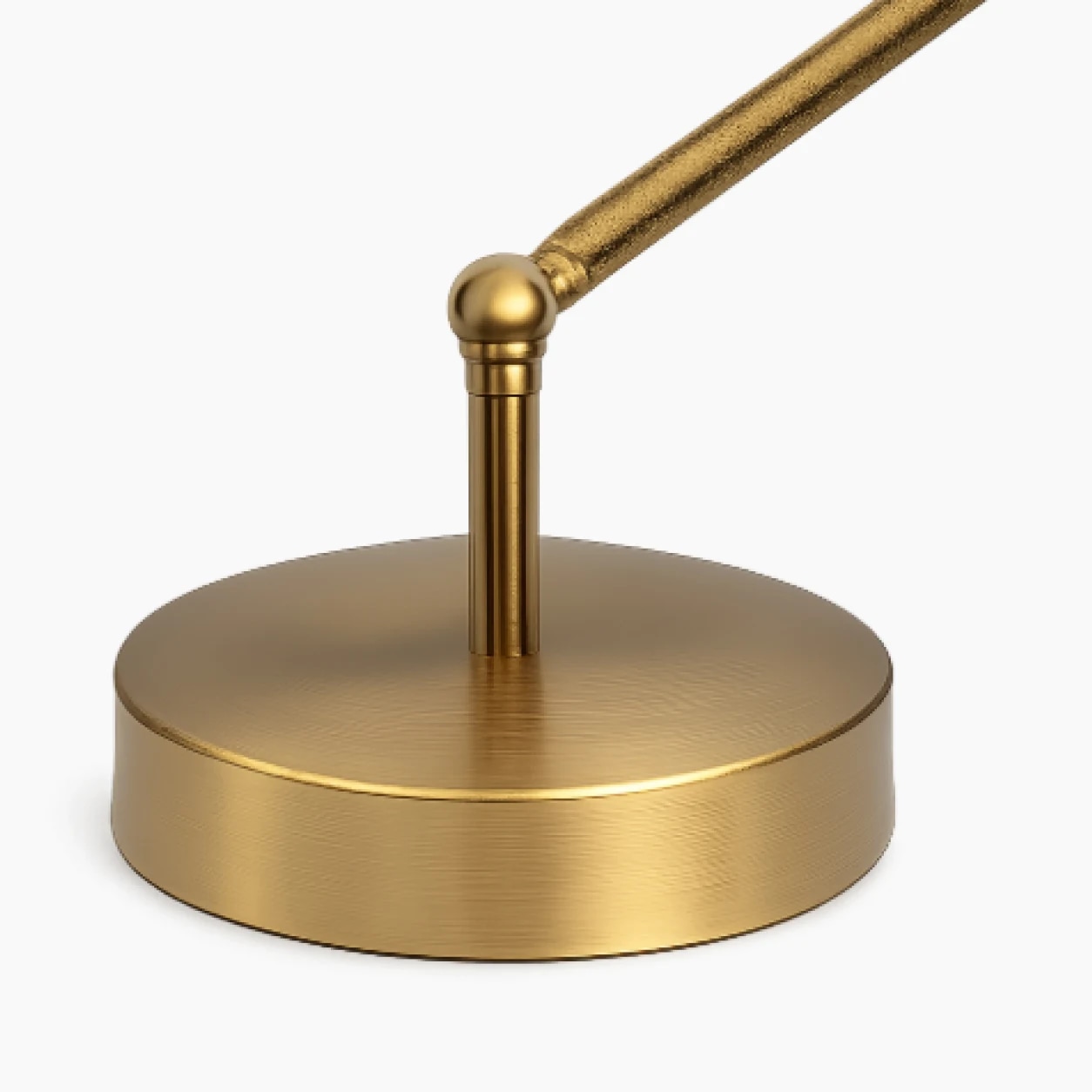 Brass-tone round base close view