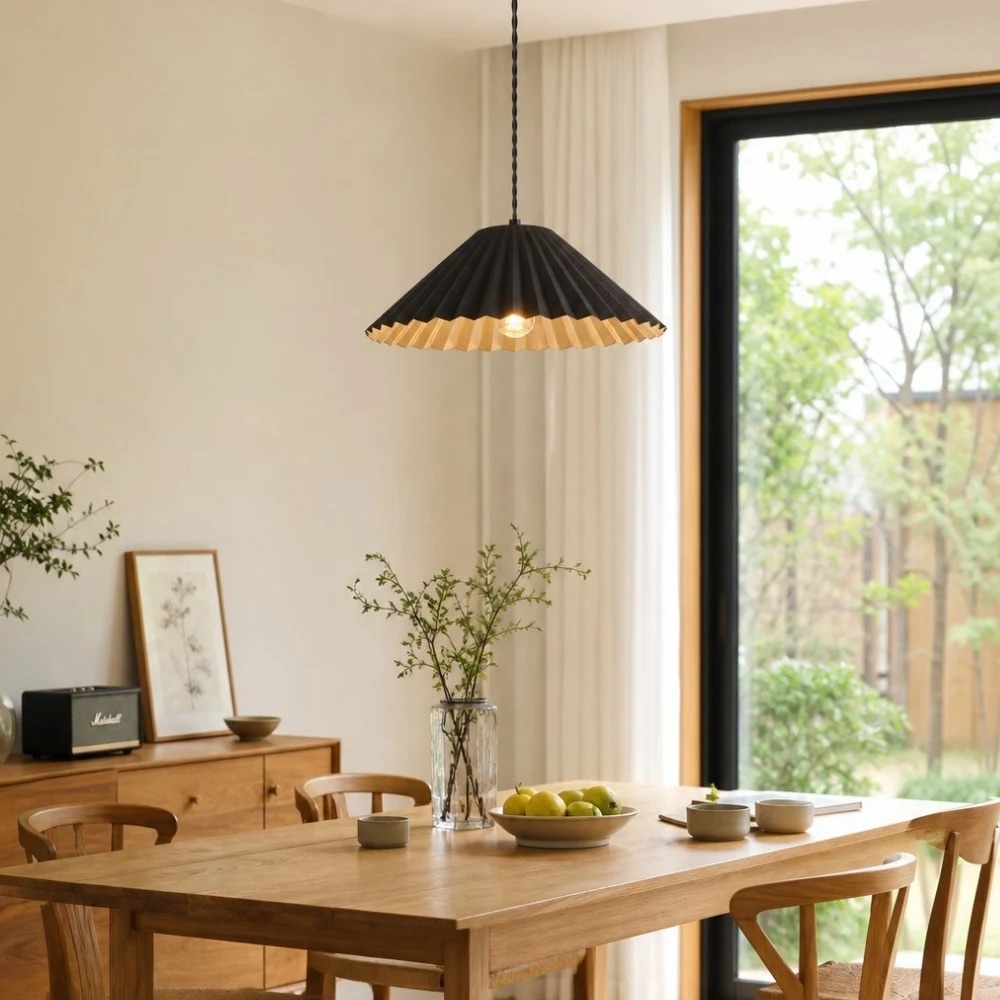 Black metal dome pendant lamp above dining table