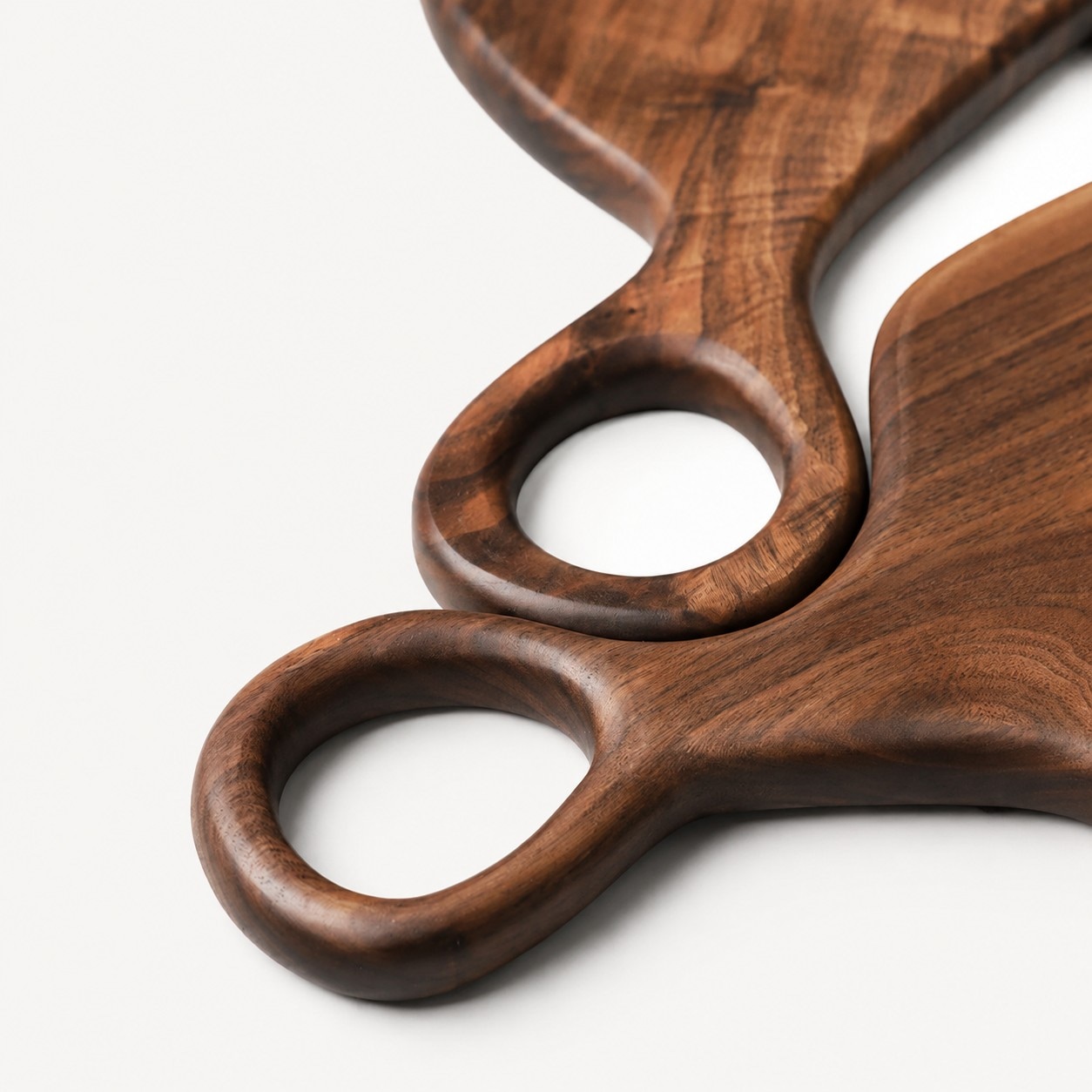 Rounded loop handle on black walnut serving board