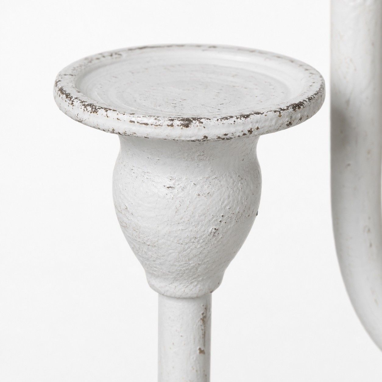 Close view of a branch candelabra candle cup and patina